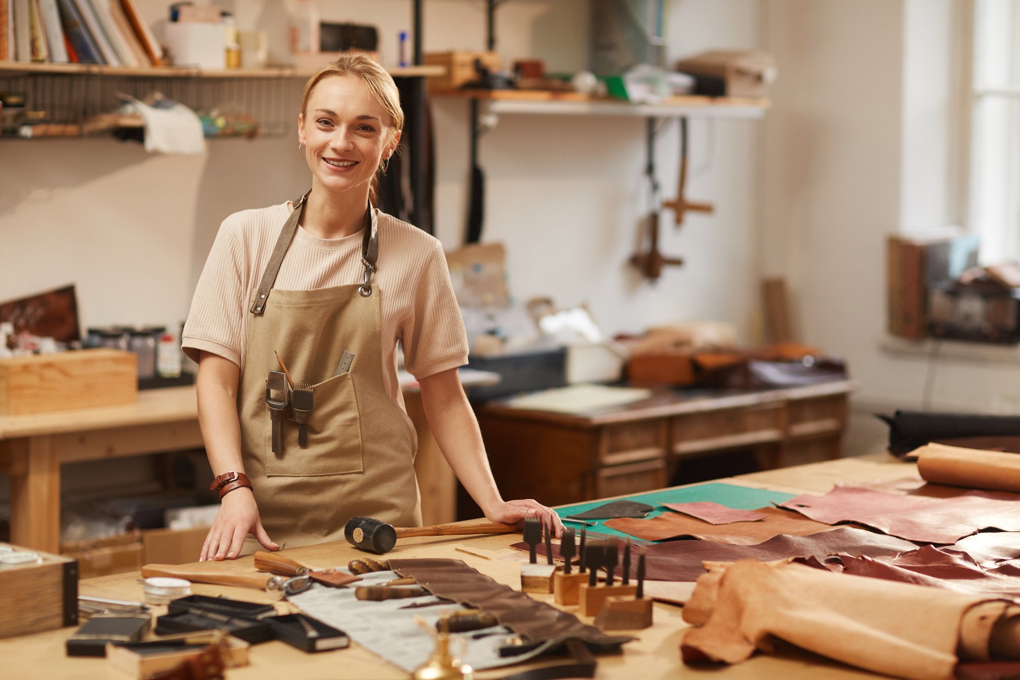 Happy Female Artisan in Workshop