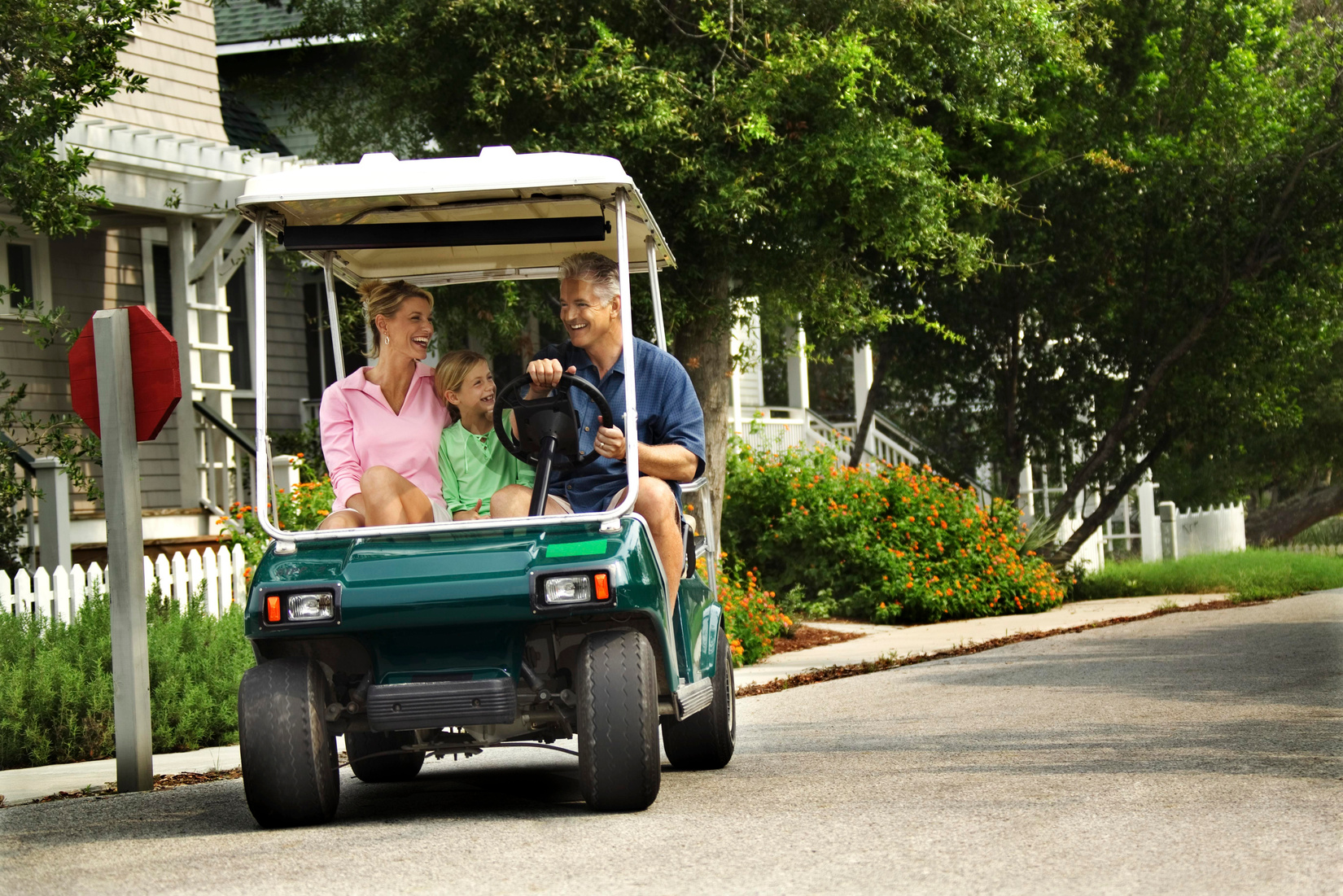 Family in golf cart